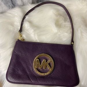 Purple Michael Kors small purse.
